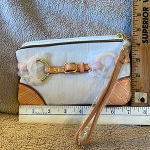 Joan Rivers canvas clutch has peach and gold color